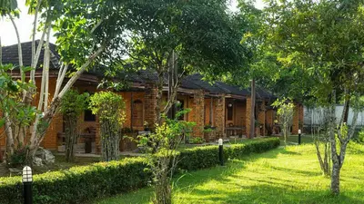 a brick house with a garden in front of it at Doo Dee Boutique Resort by Swiss Chalet in Ao Nang Beach