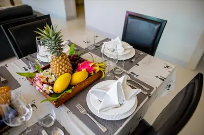 a table with a plate of fruit on it at 3 Bedroom Exclusive Private Pool Villa Smooth as Silk in Ao Nang Beach