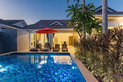 a swimming pool in front of a villa at Honeybee Pool Villa Smooth as Silk in Ao Nang Beach