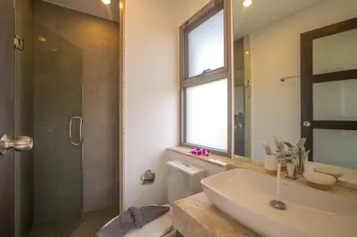 a bathroom with a toilet and a sink and a shower at Shanti Villas x MonthStayZ Thailand in Rawai Beach
