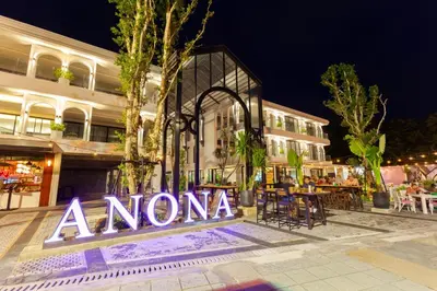 aonia sign in front of a building at night at Anona Beachfront Phuket Resort-SHA EXTRA PLUS in Patong Beach