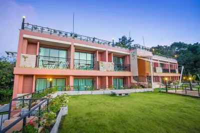 a building with a lawn in front of it at Studio apartments on a hill in Kathu