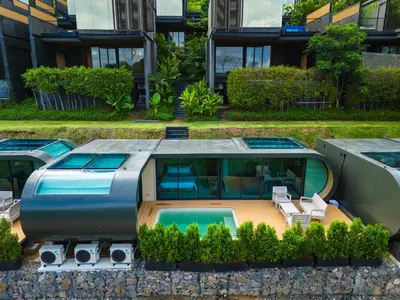 an aerial view of a house with a swimming pool at AKRA Collection Layan - Hideaway Villas in Layan Beach