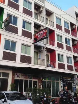 a large building with a sign in front of it at TJ Patong Hotel - Otop Shopping Paradise in Patong Beach
