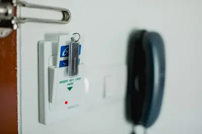 a lock on a refrigerator door with a key at Aim House in Patong Beach
