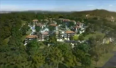 an aerial view of a large house at Top Floor, One-Bedroom Apartment in Phuket Town