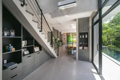 a hallway of a house with a staircase and a pool at Villa Lami - Luxury 3-Bedroom Modern Villa in Phuket with Private Pool, Gym & Sauna in Phuket Town