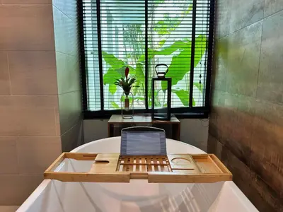 a laptop sitting on top of a bath tub at Villa Tara nr Layan Beach in Bang Tao Beach