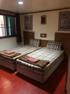 two beds sitting next to each other in a room at Phi Phi Dream Guest House in Phi Phi Don