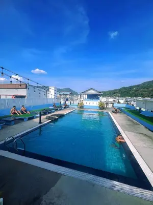 a swimming pool on the roof of a building at Hotel Baya Phuket in Patong Beach
