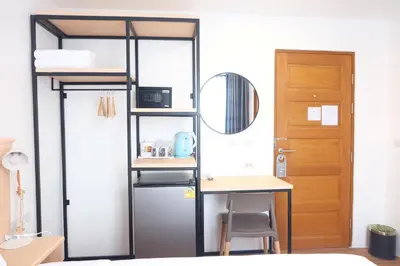 a room with a desk and a bunk bed at B3 HOUSE in Kamala Beach