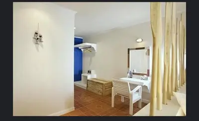 a bathroom with a sink and a mirror at AT SEA Patong in Patong Beach