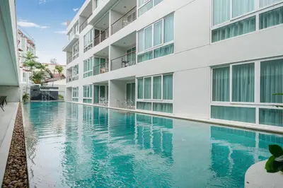 an image of a swimming pool in a building at Holiday apartment at Palms, 100 meters to beach in Kamala Beach