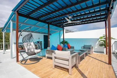 a pergola on the deck of a house at Lovely pool villa 2 bedrooms in rawai with seaview in Ban Saiyuan (1)
