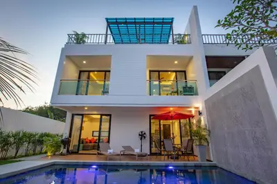 a house with a swimming pool in front of it at Lovely pool villa 2 bedrooms in rawai with seaview in Ban Saiyuan (1)