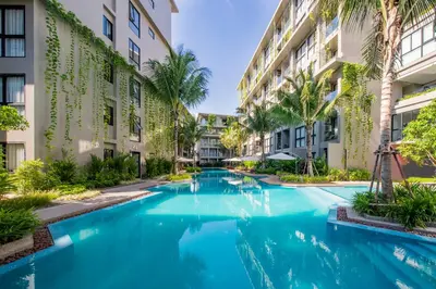a swimming pool in the middle of a building at Mountain View Apartment - Bangtao in Kathu