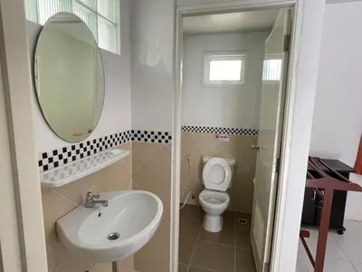 a bathroom with a sink and a toilet and a mirror at The 4 Blocks at Kata noi in Kata Beach