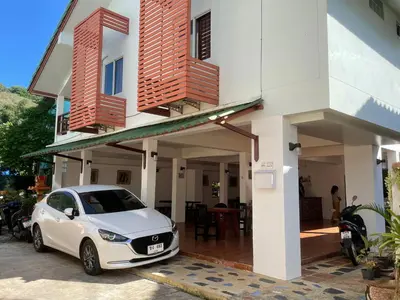 a white car parked in front of a house at The 4 Blocks at Kata noi in Kata Beach