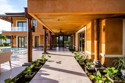 an indoor courtyard of a house with plants at VILLA DIVA STAR in Ko Yao Noi