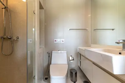 a bathroom with a toilet and a sink and a shower at Aristo 1 Phuket by RESAVA in Phuket Town
