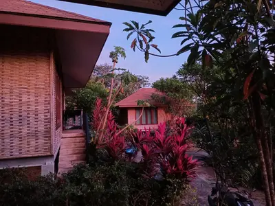 a house with a bunch of plants in front of it at The mantra resort in Ko Yao Yai