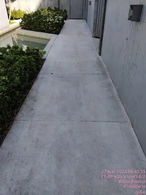 a concrete sidewalk next to a building at Tao Resort and Villas (SHA Extra+) in Phuket Town
