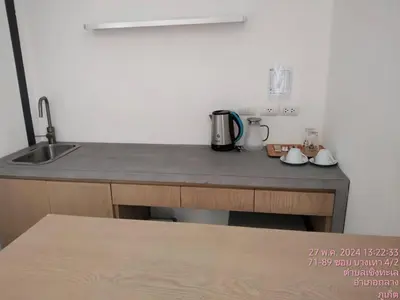 a kitchen with a counter top with a sink and a counter top at Tao Resort and Villas (SHA Extra+) in Phuket Town