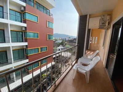a balcony of a building with a bench on it at Nanai 2 Residence Patong Phuket in Patong Beach