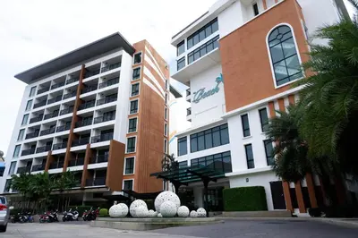 a building with white eggs in front of it at The Beach Heights Resort SHA Plus in Kata Beach