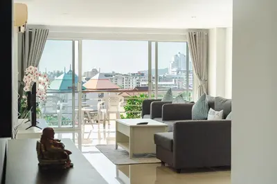 a living room with a view of a city at Private apartment at Bayshore by Lofty in Patong Beach