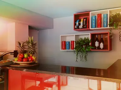 a kitchen with a table with fruits and wine bottles at Anchor Boutique House in Patong Beach