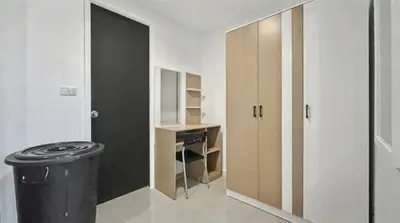 a room with a hallway with a desk and a door at Kris - Modern Spacious 2 Bedrooms Condo with Pool in Patong Beach
