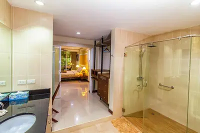 a bathroom with a shower and a sink at Karon View Apartments in Karon Beach