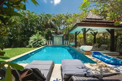 a swimming pool in a backyard with a gazebo at Wonderful Villa in Rawai with Private Pool in Rawai Beach