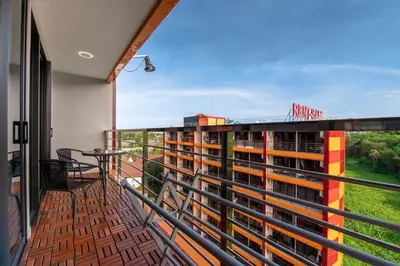 a balcony with a view of a building at Nai Harn Beach Condominium in Nai Harn Beach