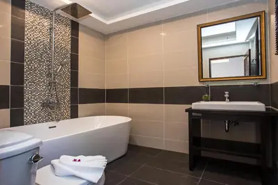 a bathroom with a tub and a sink at Best Holidays - Oxygen pool, Billard, Gym! 2-Storey Tropical Villa Havana N in Kamala Beach