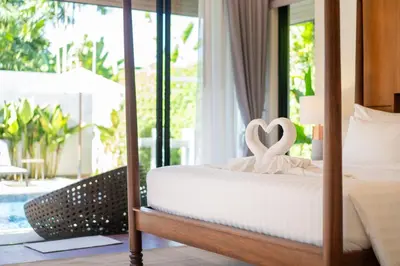 a bedroom with a bed with a heart decoration on it at Anchan Villas Phuket - Private 2 Bedroom Pool Villas by Escape Villas in Bang Tao Beach