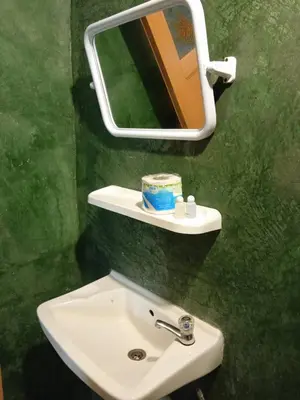 a bathroom with a sink and a mirror at PhiPhi Film House in Phi Phi Don