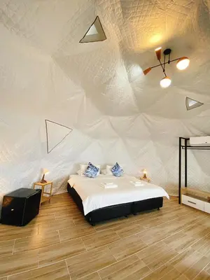 a bedroom with a large bed in a tent at Touch Glamping Koh Yao Noi ทัช แกรมปิ้ง เกาะยาวน้อย in Ko Yao Noi