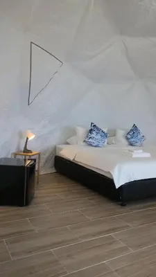 a bedroom with a bed in a tent at Touch Glamping Koh Yao Noi ทัช แกรมปิ้ง เกาะยาวน้อย in Ko Yao Noi