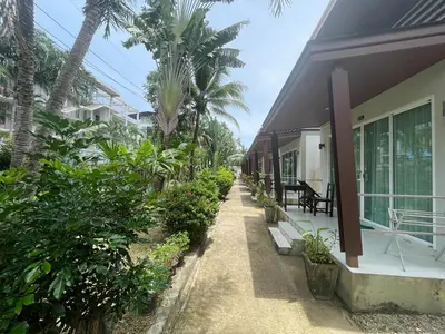 a house with a pathway leading to the front of it at Naiyang Boutique Resort in Ban Phak Chit