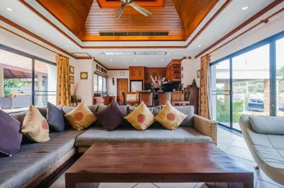 a living room with a couch and a table at Lotus Pool Villa Your Own Slice Of Island Paradise in Rawai Beach