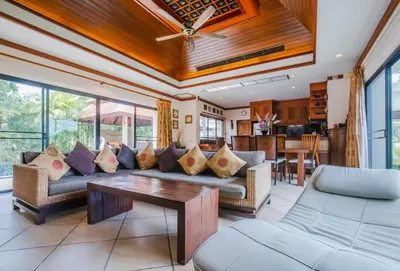 a living room with couches and a table at Lotus Pool Villa Your Own Slice Of Island Paradise in Rawai Beach