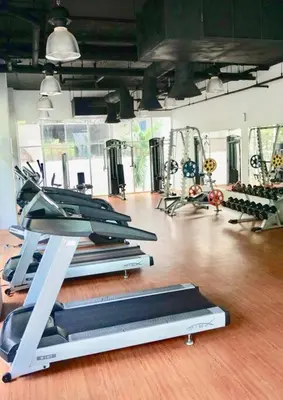 a gym with rows of treadmills and machines at Phuket Kamala, Spectacular Seaviews, Private pool, 3 BR in Kamala Beach
