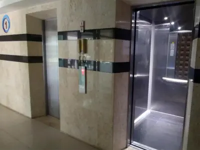 a shower in a building with a glass door at Kata Beach OZONE Superb Fully Equipped studio kitchen washing machine air con in Kata Beach