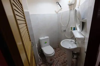 a small bathroom with a toilet and a sink at Phi Phi Blue Lagoon in Phi Phi Don