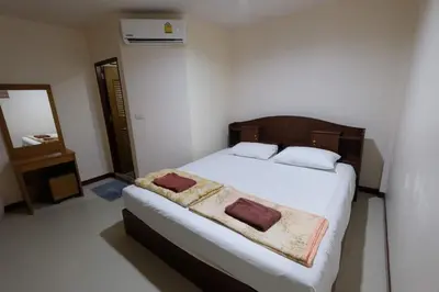 a bedroom with a bed with two towels on it at Phi Phi Blue Lagoon in Phi Phi Don