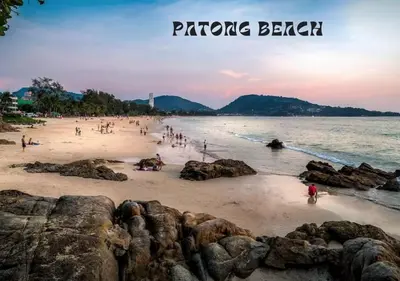 a group of people on a beach at sunset at Patong - The Unity Seaview & Mountain Residence in Patong Beach