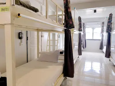 a bedroom with two bunk beds in a room at Remember at Phuket Town Hostel in Phuket Town
