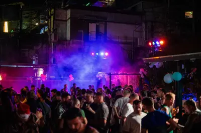 a crowd of people at a party with purple lights at Base Ao Nang Beachfront Party Hostel 18-35 Years Old Only in Ao Nang Beach